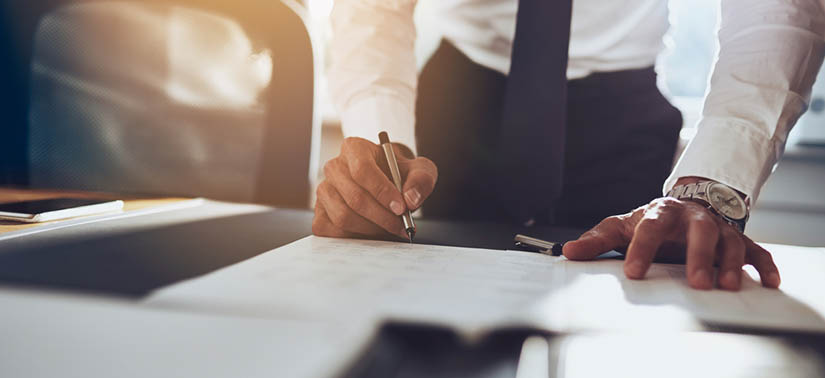 Man signing documents